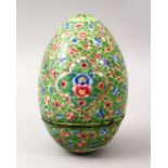 A GOOD 19TH CENTURY CHINESE CANTON ENAMEL EGG, the egg with a green ground with floral panel