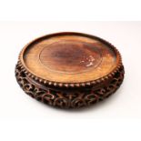 A GOOD 19TH CENTURY CHINESE CARVED HARDWOOD STAND, the sides with carved and pierced decoration,