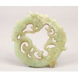 A GOOD 19TH / 20TH CENTURY CHINESE CARVED JADE PENDANT / DISK OF CHILONG / DRAGON, 9.5cm diameter.