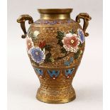 A JAPANESE CLOISONNE ENAMEL TWIN HANDLED VASE, decorated to depict floral display, 21.5cm high.