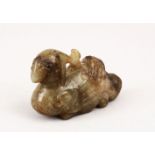 A GOOD 19TH / 20TH CENTURY CHINESE CARVED JADE PENDANT OF A RECUMBENT BIRD, in a recumbent position,