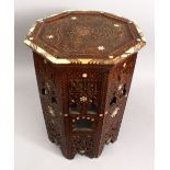 A 19TH CENTURY MOORISH CARVED HARDWOOD OCTAGONAL INLAID OCCASIONAL TABLE, inlaid with mother of