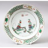A GOOD CHINESE KANGXI PERIOD FAMILLE VERTE PORCELAIN DISH, decorated with scenes of floral