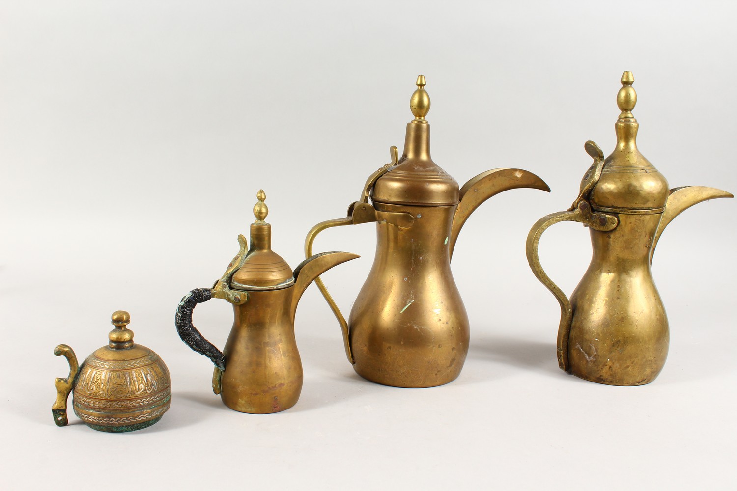 A SET OF THREE ANTIQUE ARABIC BRASS COFFEE POTS SIGNED DALLAH & AN ISLAMIC SILVER INLAID LID, coffee - Image 6 of 15
