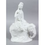 A 20TH CENTURY CHINESE BLANC DE CHINE PORCELAIN FIGURE OF GUANYIN UPON ELEPHANT, 31.5CM HIGH