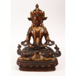 A GOOD CHINESE GILT & BRONZE FIGURE OF BUDDHA / DEITY, in a seated position holding a vessel, the