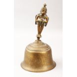 AN INDIAN BRASS GHANTI/BELL, the body engraved with animals, 23.5cm high, bell 14cm diameter.