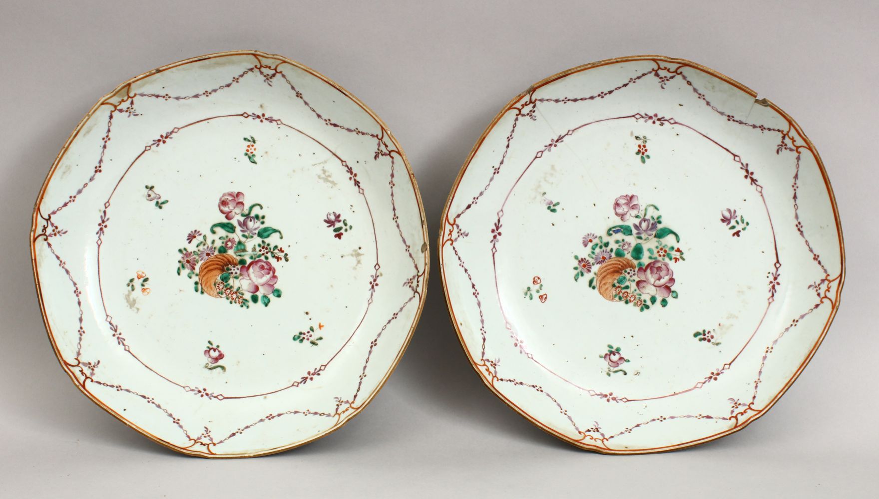 A PAIR OF 18TH CENTURY CHINESE FAMILLE ROSE QIANLONG PORCELAIN PLATES, with floral decoration, 27.