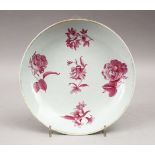 A GOOD 18TH CENTURY CHINESE PORCELAIN PLATE, decorated with scenes of roses, 21.5cm