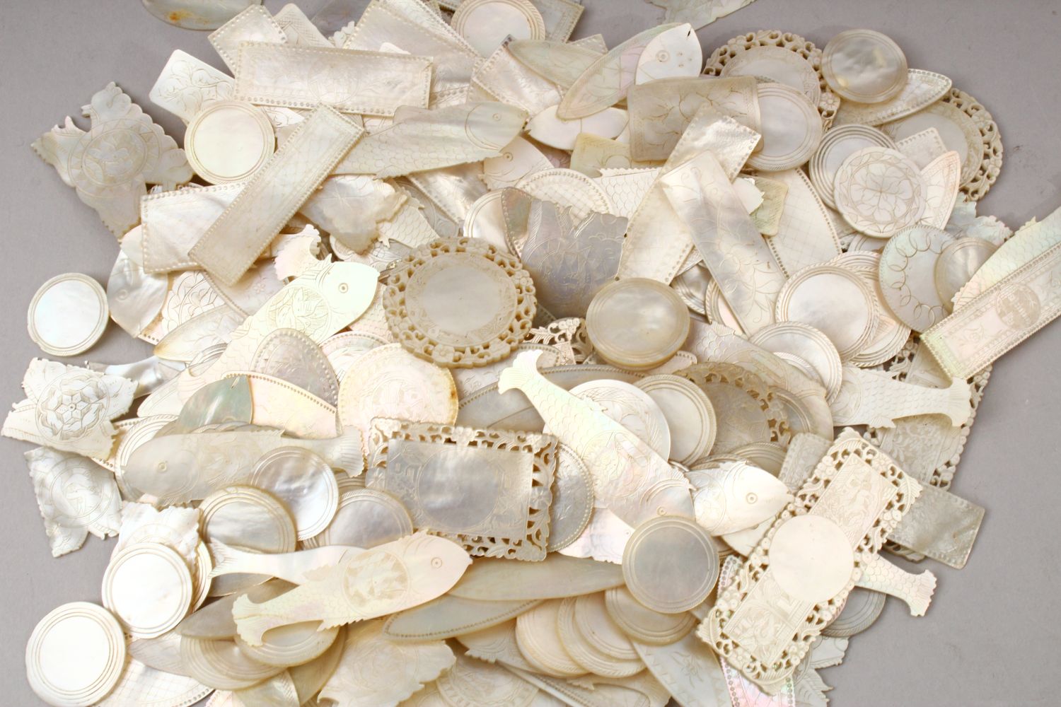 A QUANTITY OF 19TH CENTURY CHINESE CARVED MOTHER OF PEARL GAME COUNTERS, various styles an sizes. - Image 9 of 9