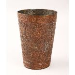 A 19TH CENTURY OTTOMAN COPPERED METAL BEAKER, with floral motif decoration, 12cm high.