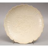 A GOOD CHINESE MOULDED MONOCHROME PORCELAIN DISH, decorated with floral decoration, 20.5cm