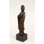 A GOOD CHINESE POSSIBLY MING DYNASTY BRONZE FIGURE OF GUANYIN, on a later pegged base for diaplay,