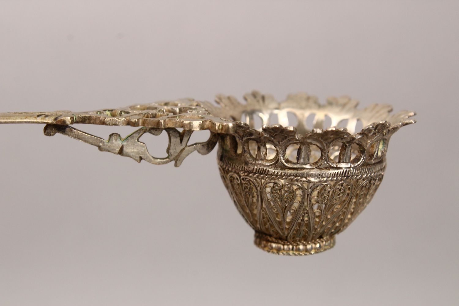 A 19TH CENTURY INDIAN SILVER FILIGREE TEA STRAINER, 17cm long. - Image 2 of 3