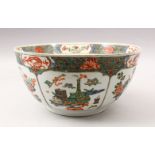A 19TH CENTURY CHINESE FAMILLE VERTE PORCELAIN BOWL / BASIN, decorated with panel decoration