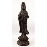 A LARGE 19TH / 20TH CENTURY CHINESE CARVED HARDWOOD FIGURE OF GUANYIN, stood upon a lotus base,