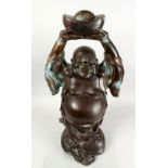 A GOOD 19TH CENTURY CHINESE BRONZE FIGURE OF BUDDHA, stood bearing an enchanting grin, the robes