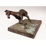 A CAST BRONZE STATUE OF AN ARAB STALLION, in a leaning / galloping pose on a stylized base,