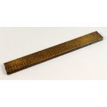 A GOOD 19TH / 20TH CENTURY CHINESE SCHOLARS RULER, with inlaid brass calligraphy work, 45cm long