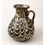 A GOOD EARLY SYRIAN / EGYPTIAN MAMLUK GLASS JUG, with moulded handle and polychrome decoration, 12cm