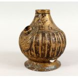 A 18TH CENTURY MUGHAL BRASS HUQQA BASE, with a ribbed body, 13cm high.