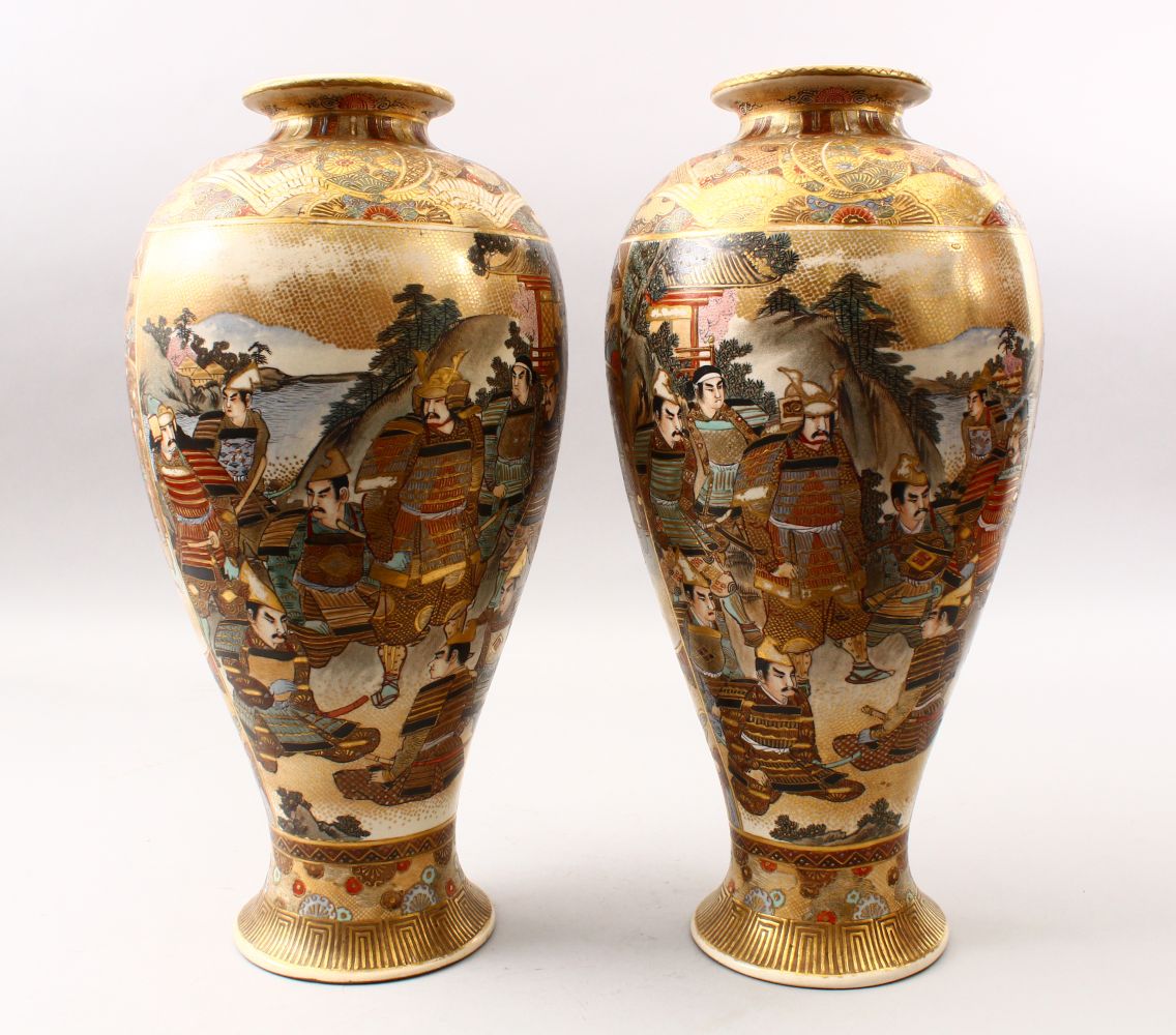 A GOOD PAIR OF JAPANESE MEIJI PERIOD SATSUMA VASES, the ovoid body decorated with scenes of warriors