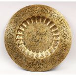 A LARGE 19TH CENTURY ENGRAVED BRASS BIDRIWARE TRAY, with decorative floral motifs, 60cm diameter.