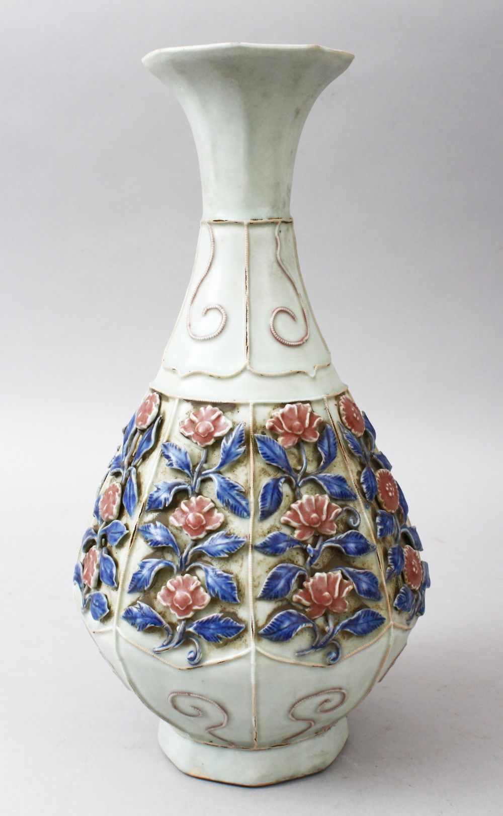 AN UNUSUAL CHINESE MOULDED / CLAIR DE LUNE CELADON BOTTLE VASE, the vase with relief moulded panel