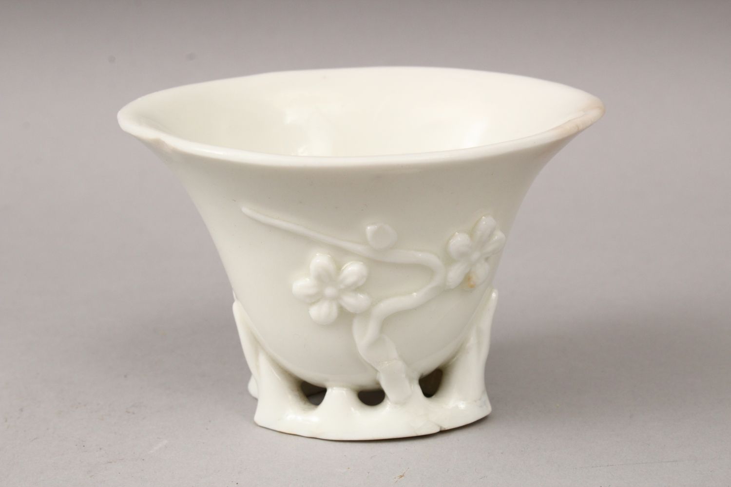 A 19TH CENTURY CHINESE BLANC DE CHINE PORCELAIN LIBATION CUP, with moulded relief decoration - Image 2 of 3
