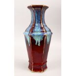 A GOOD CHINESE FLAMBE HEXAGONAL SHAPED PORCELAIN VASE, with a graduating glaze, the base bearing a