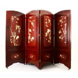 A GOOD JAPANESE MEIJI PERIOD CARVED IVORY AND LACQUER FOUR FOLD SCREEN, The red lacquer with