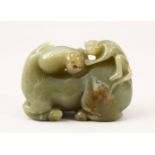 A GOOD 19TH CENTURY CHINESE CARVED JADE FIGURE OF A SEATED HORSE, the horse with a monkey climing