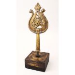 A GOOD 19TH CENTURY INDIAN CALLIGRAPHIC BRONZE ALAM, mounted upon a base, the Alam itself 23cm x