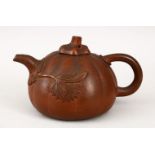 A GOOD CHINESE 19TH / 20TH CENTURY YIXING CLAY PUMPKIN FORM TEA POT, the body with raised relief