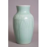A CHINESE CELADON RELIEF / MOULDED PORCELAIN BALUSTER VASE, the shoulder with a relief decorated