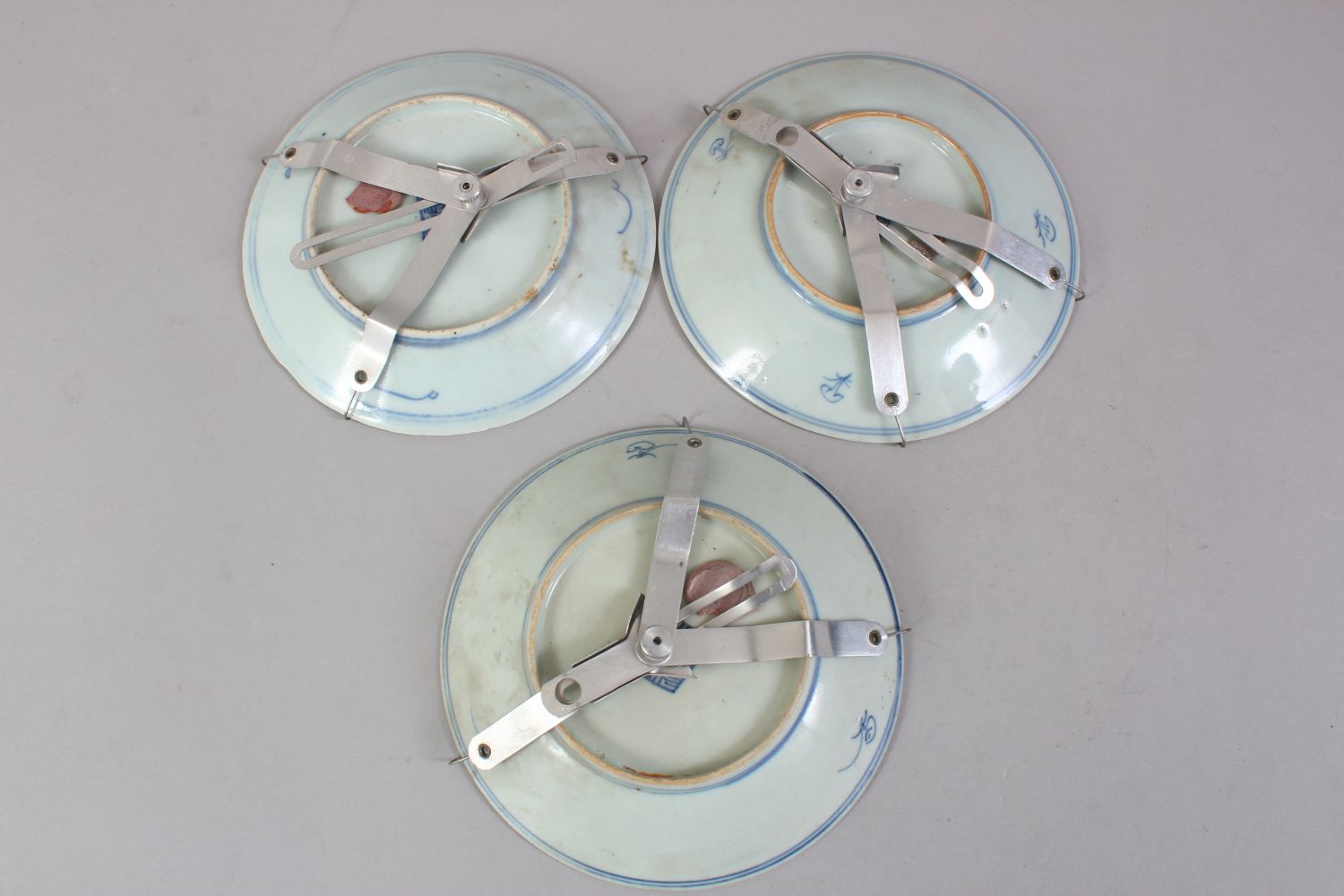 THREE 19TH CENTURY CHINESE BLUE & WHITE PORCELAIN PLATES, all with metal hanging brackets, the verso - Image 2 of 3