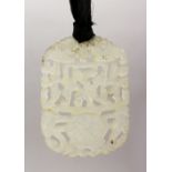 A GOOD 19TH / 20TH CENTURY CHINESE CARVED CLEAR JADE PENDANT, carved to depict floral display, 7cm x