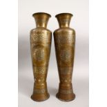 A LARGE PAIR OF ISLAMIC SILVER & COPPER INLAID BRONZE / BRASS CALLIGRAPHIC VASES, decorated with