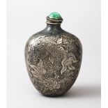 A GOOD CHINESE SILVER LOTUS CARVED SNUFF BOTTLE- SIGNED, the bottle with carved decoration depicting