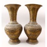 A PAIR OF PERSIAN PIERCED BRASS OPENWORK VASES, decorated with roundel's of figures and borders of