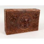 A GOOD 19TH CENTURY INDIAN CARVED WOOD LIDDED BOX, with relief carved floral decoration, 9cm high