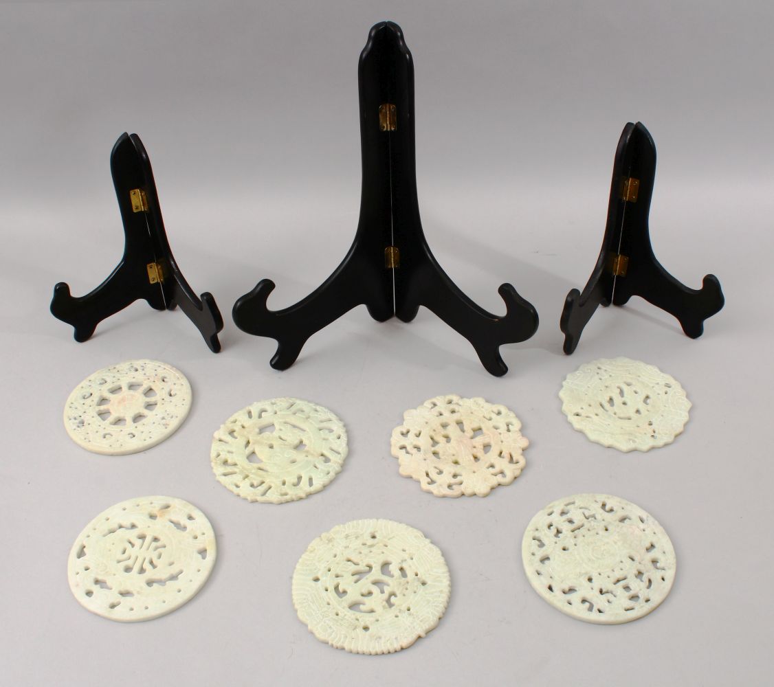 SEVEN SMALLER 20TH CENTURY CHINESE CARVED HARDSTONE / JADELIKE BI - DISKS, each disk carved