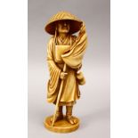 A JAPANESE MEIJI PERIOD CARVED & STAINED IVORY OKIMONO OF KOBODAISHI PRIEST - BY SOZAN, the