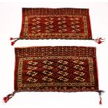 A GOOD PAIR OF PERSIAN FLOOR CARPET CUSHION COVERS with geometric design, each 120cm x 70cm.