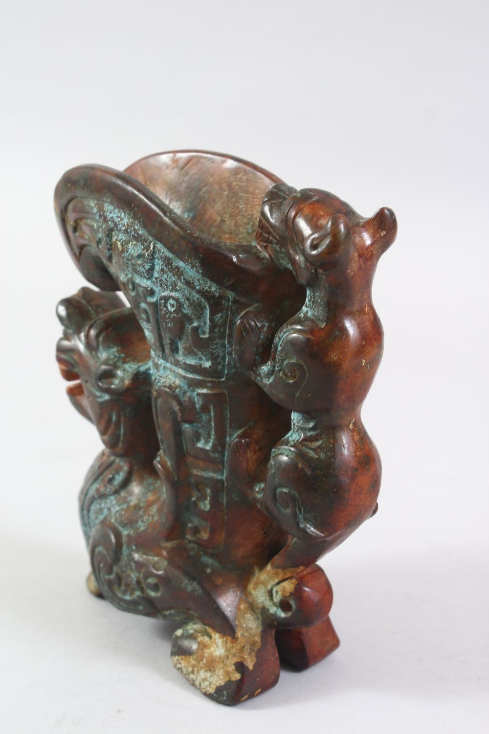 A 20TH CENTURY CHINESE ARCHAIC STYLE CARVED HARDSTONE EWER, the body carved as a dragon, the - Image 3 of 6