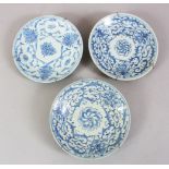THREE 19TH CENTURY CHINESE BLUE & WHITE PORCELAIN PLATES, all with metal hanging brackets, the verso