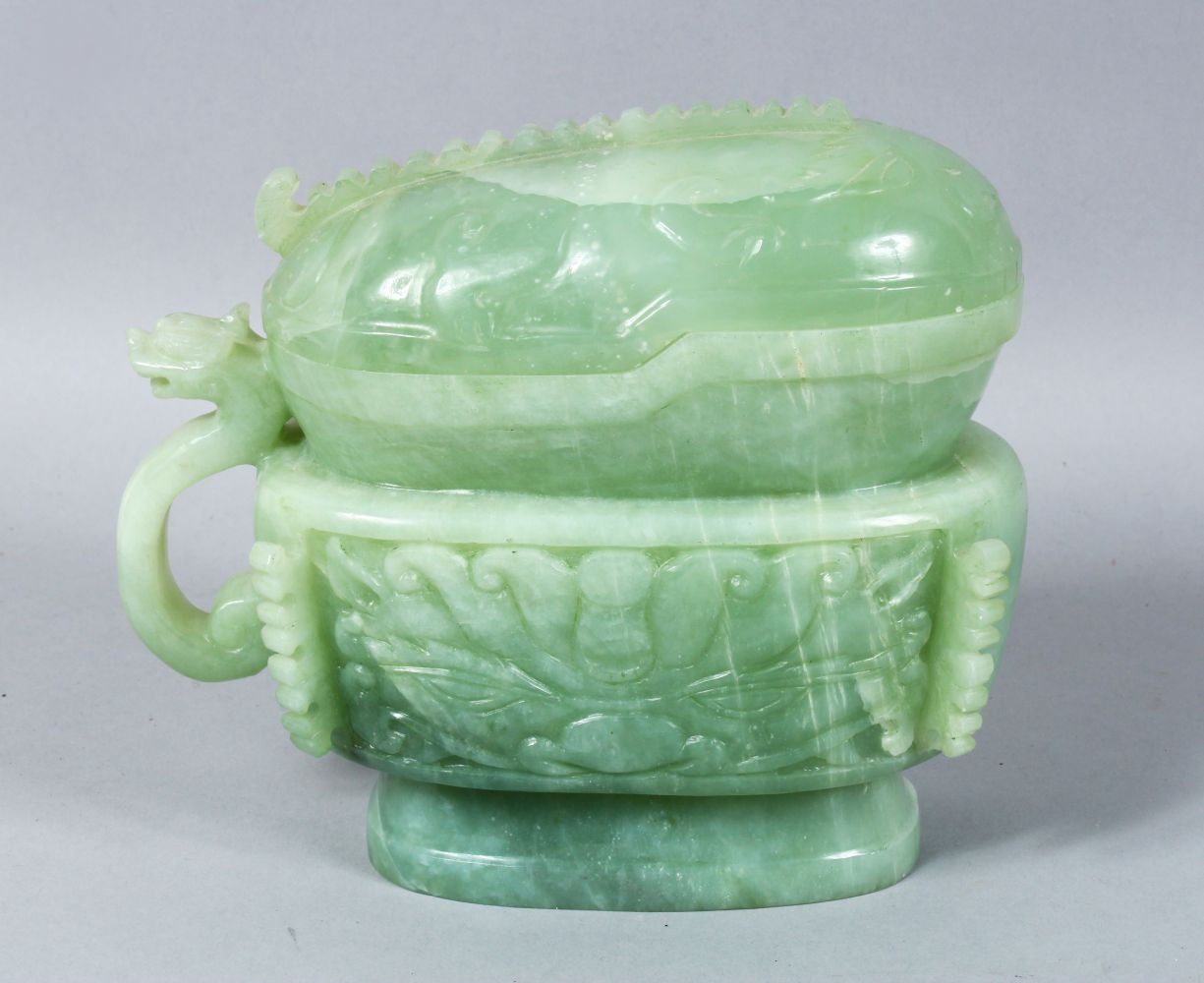 A LARGE 19TH / 20TH CENTURY CARVED JADE POT & COVER, carved in the form of a sauce boat, with a