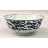A 16TH CENTURY CHINESE MING DYNASTY BLUE & WHITE PORCELAIN BOWL, With scrolling foliage design, 16cm
