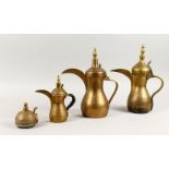 A SET OF THREE ANTIQUE ARABIC BRASS COFFEE POTS SIGNED DALLAH & AN ISLAMIC SILVER INLAID LID, coffee