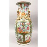 A 19TH CENTURY CHINESE CANTON FAMILLE ROSE PORCELAIN VASE, with panel decoration depicting figures